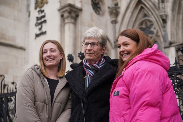 <p>Former subpostmistress Kathleen Crane (centre) outside the Royal Courts of Justice in London after judges quashed her fraud conviction</p>