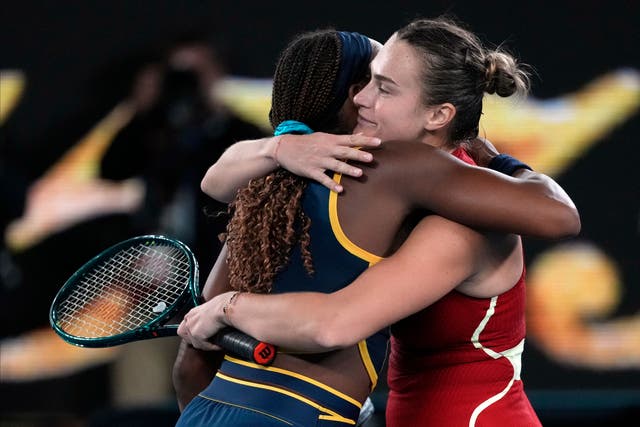 Aryna Sabalenka, right, and Coco Gauff embrace following their Australian Open semi-final (Alessandra Tarantino/AP)