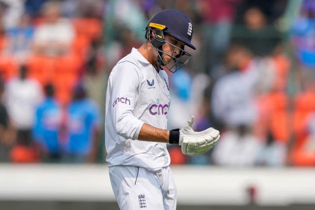England’s Tom Hartley walks back to pavilion after being dismissed by India’s Ravinder Jadeja (AP)