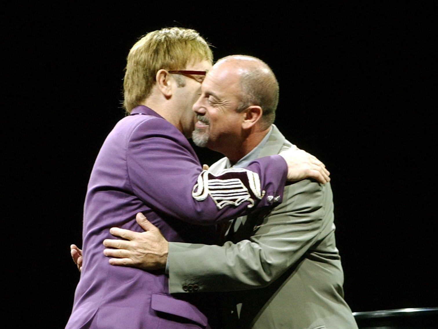 Billy Joel and Sir Elton John embrace before playing together at Madison Square Garden