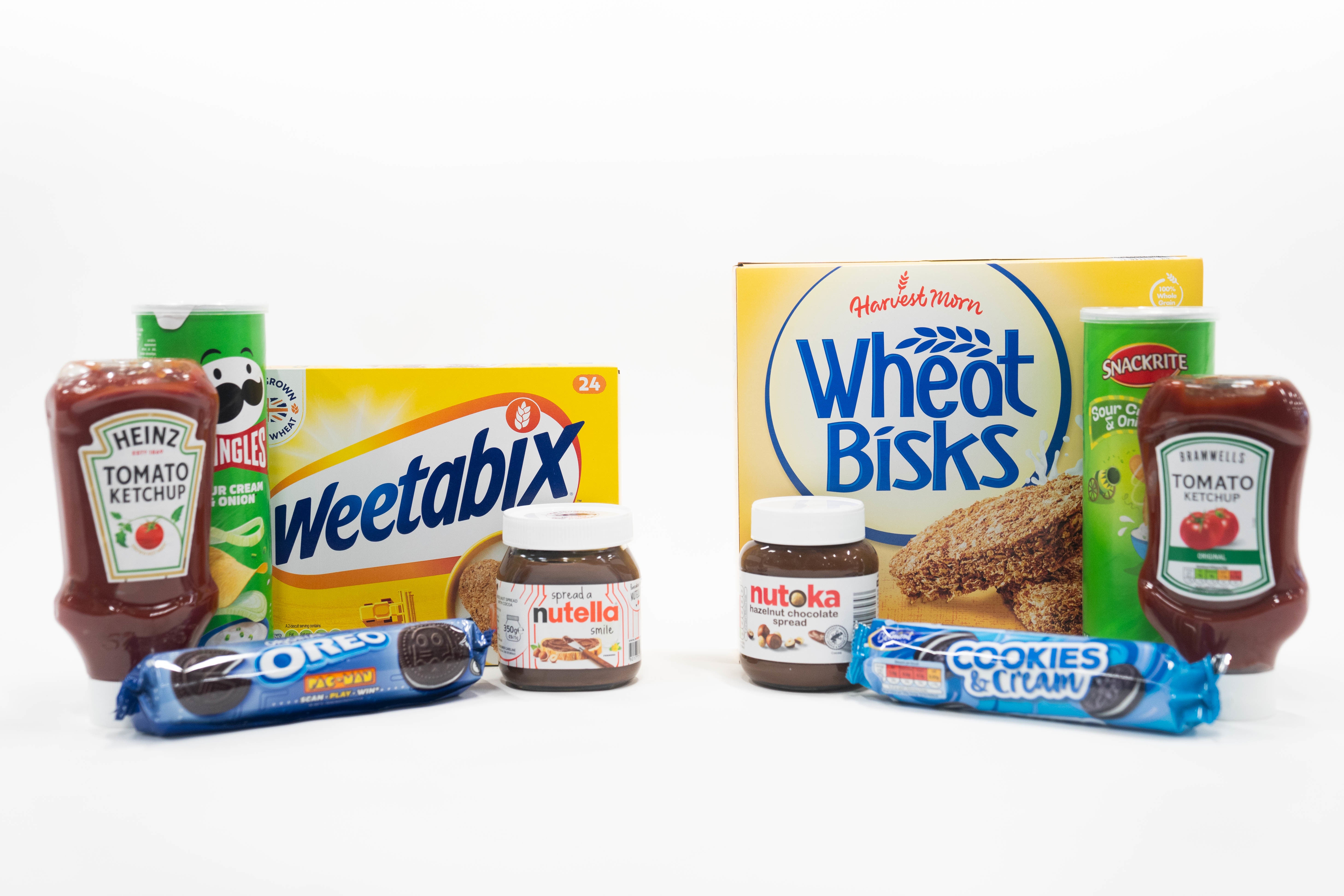 A line-up of well-known consumer products (left to right) Heinz tomato ketchup, sour cream and onion Pringles, Weetabix cereal, original Oreos, and Nutella chocolate spread, alongside products sold by Aldi