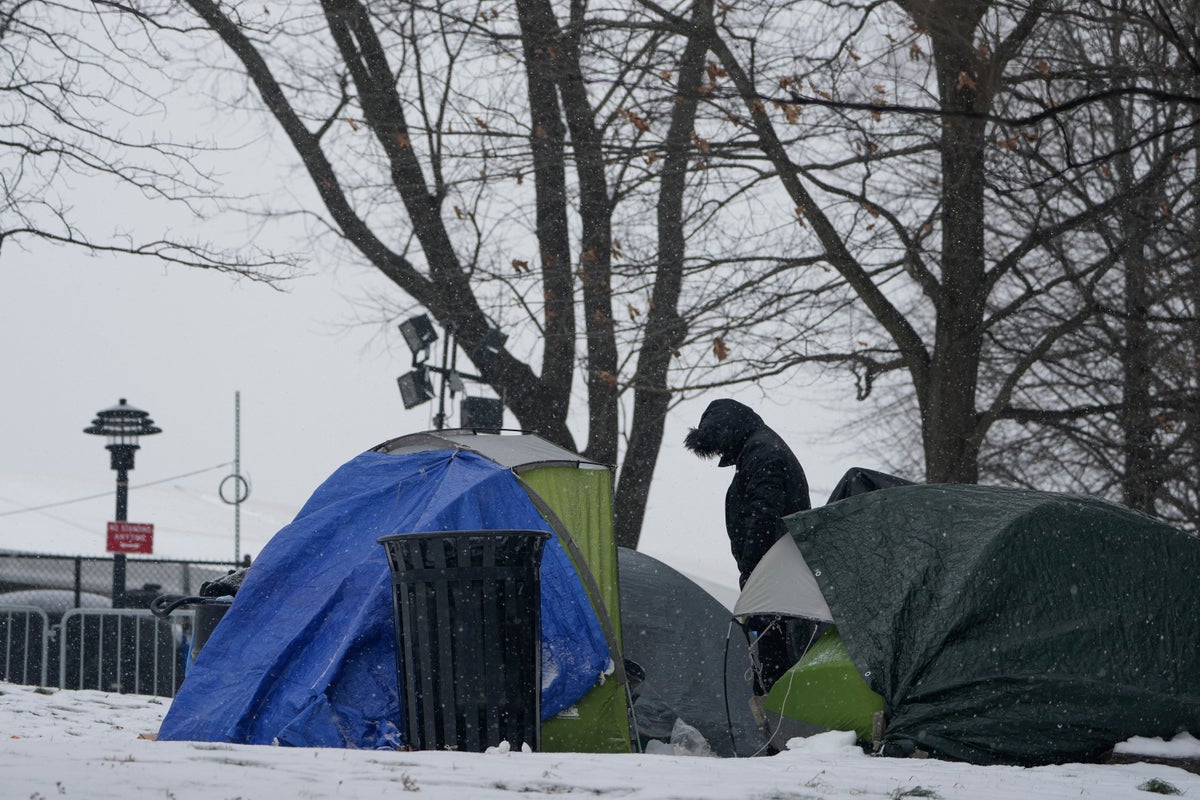 With beds scarce and winter bearing down, a tent camp grows outside NYC's largest migrant shelter