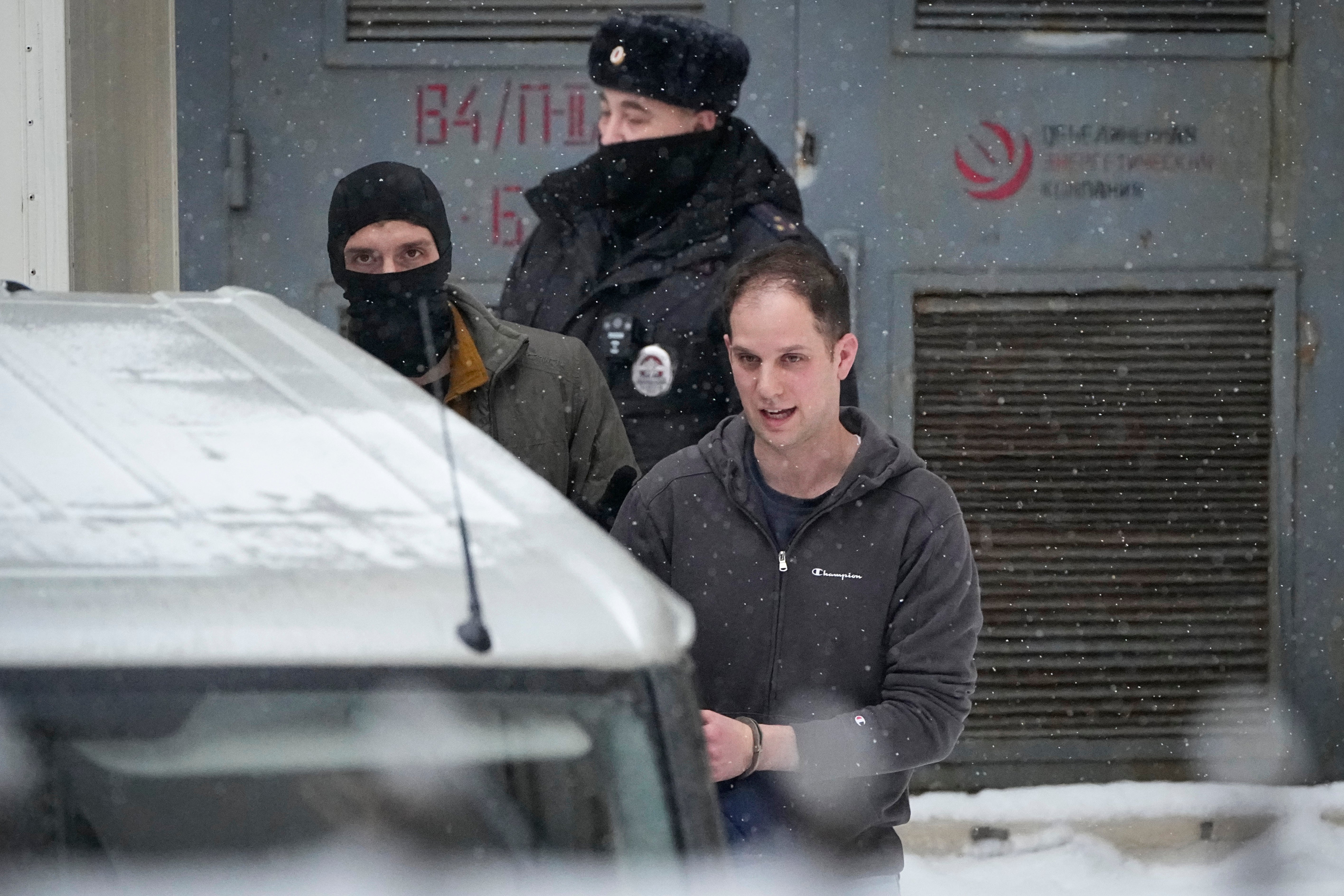 Wall Street Journal reporter Evan Gershkovich, right, is escorted from the Lefortovsky court in Moscow, Russia.