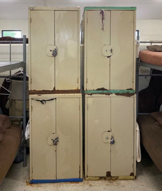 Rusted inmate lockers in a housing unit at the prison