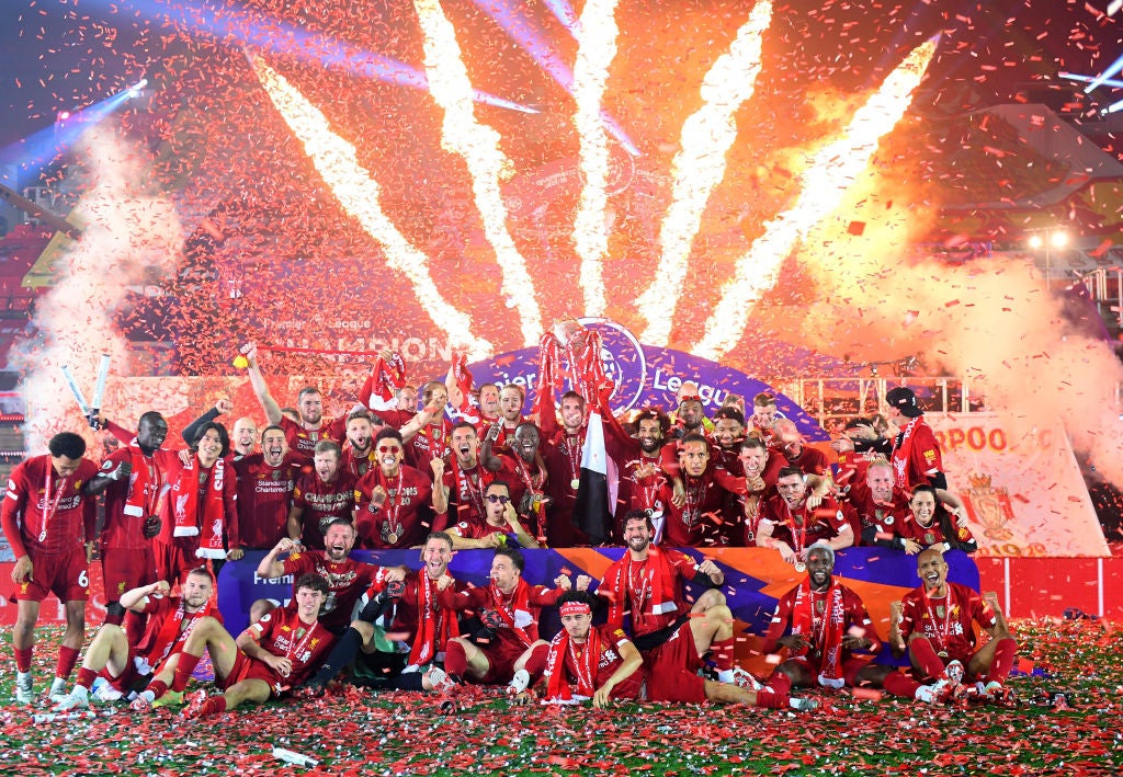 Jordan Henderson lifts the Premier League trophy at Anfield in July 2020