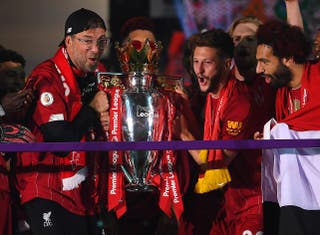Adam Lallana (centre right) lifted the Premier League and Champions League with Liverpool