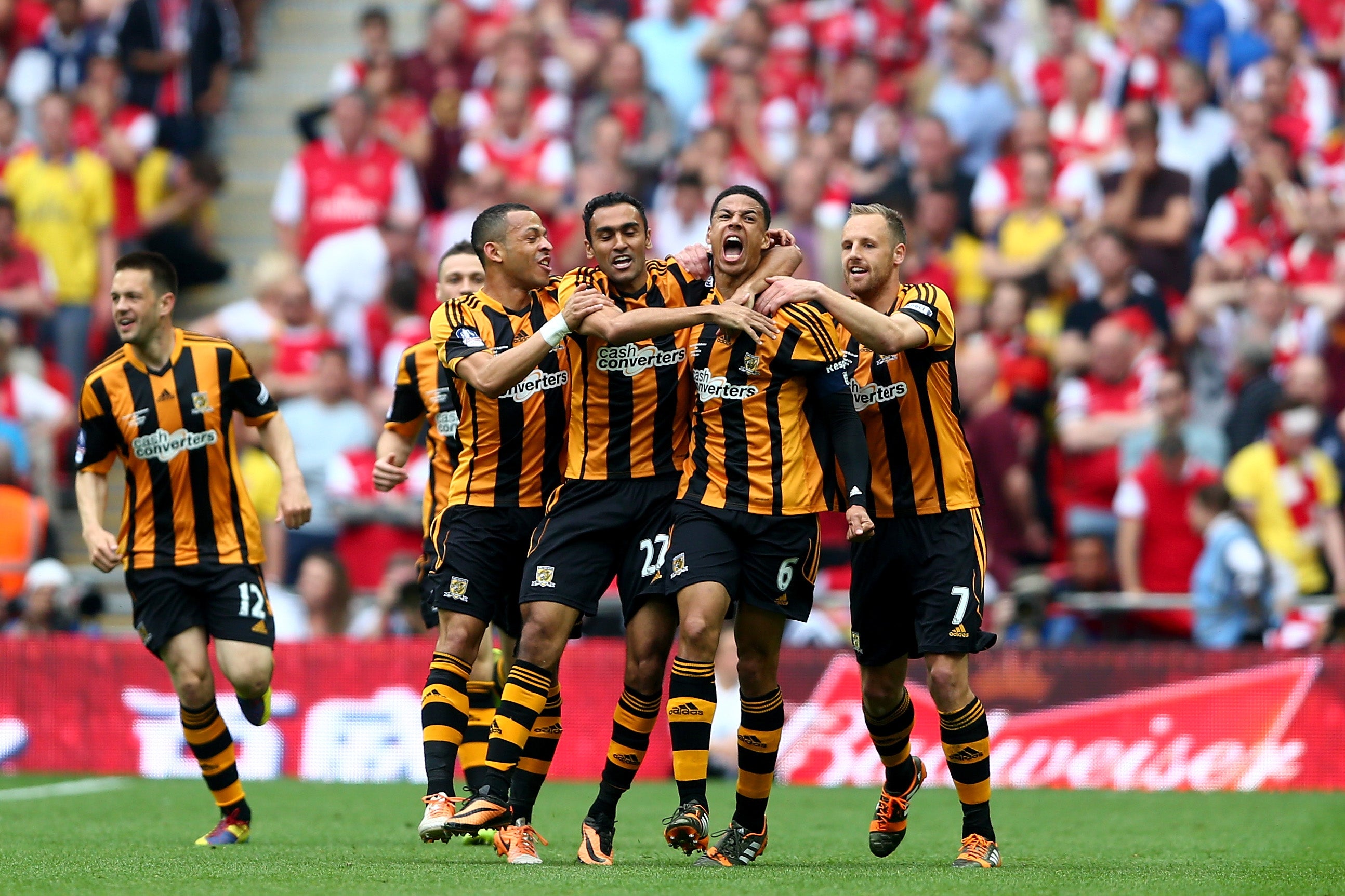 Curtis Davies celebrates with his Hull team mates after scoring in the FA Cup final