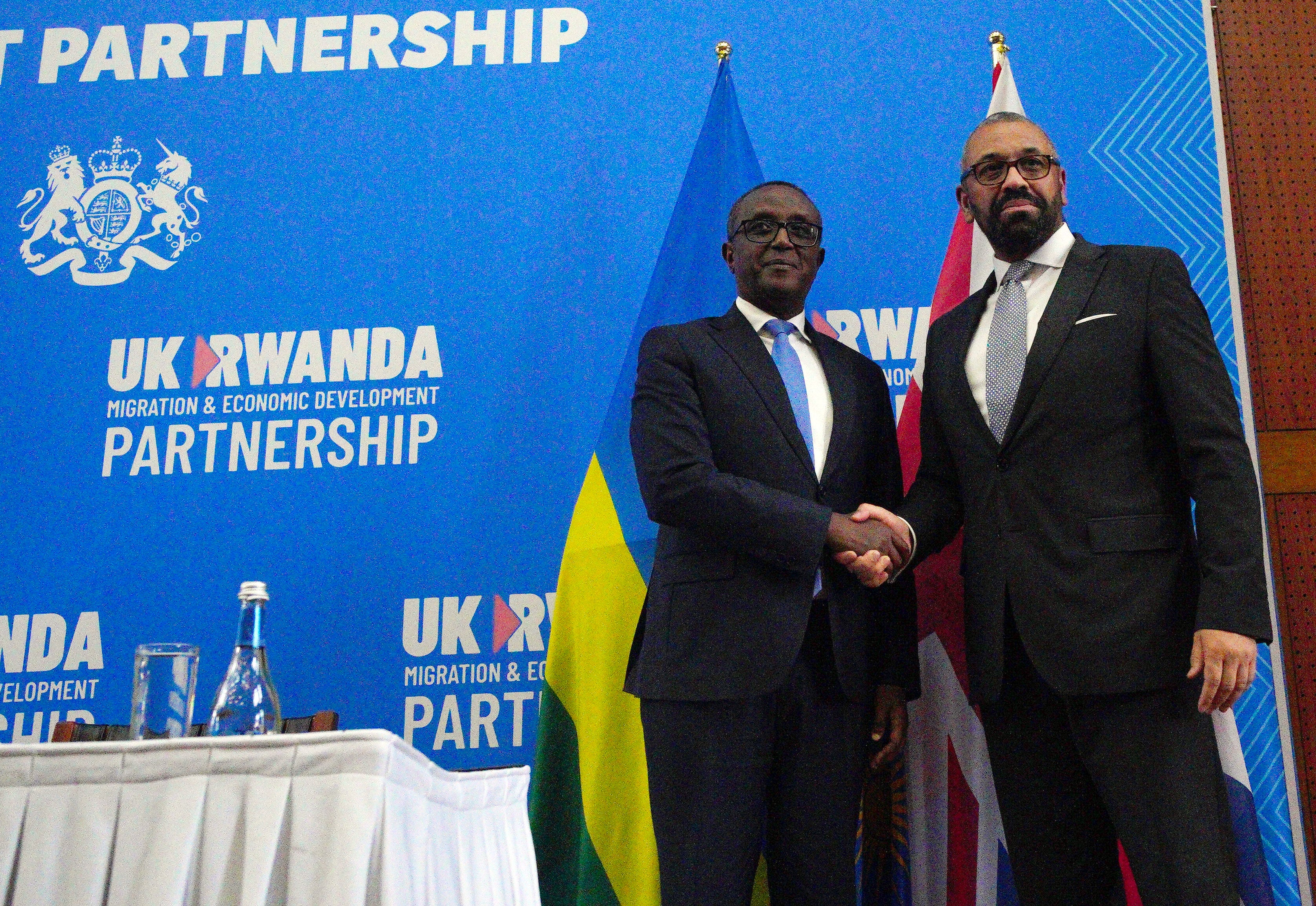 Home secretary James Cleverly and Rwanda’s foreign minister Vincent Biruta shake hands after signing a new treaty in Kigali in December