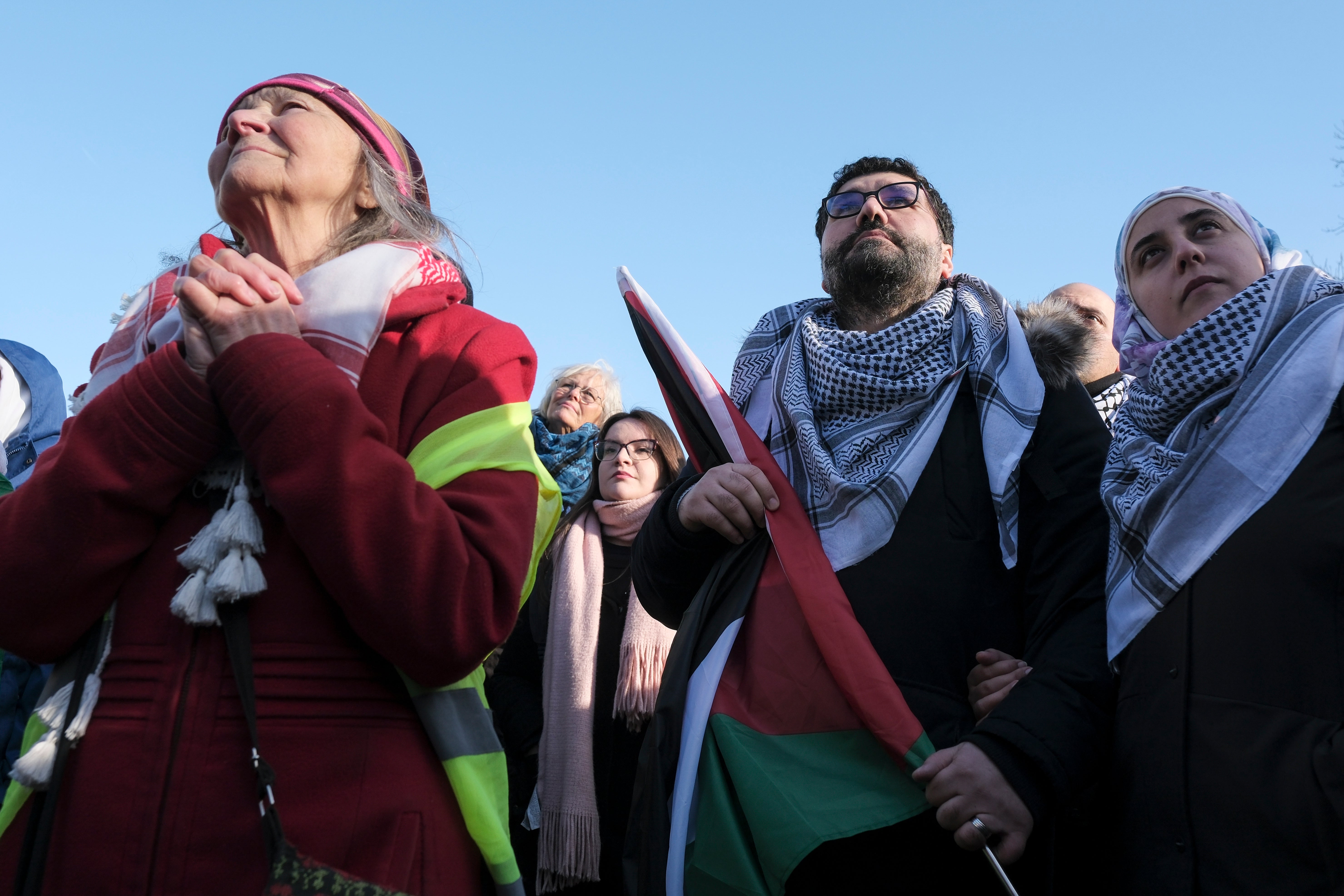 Pro-Palestinian activists react near the ICJ building in The Hague