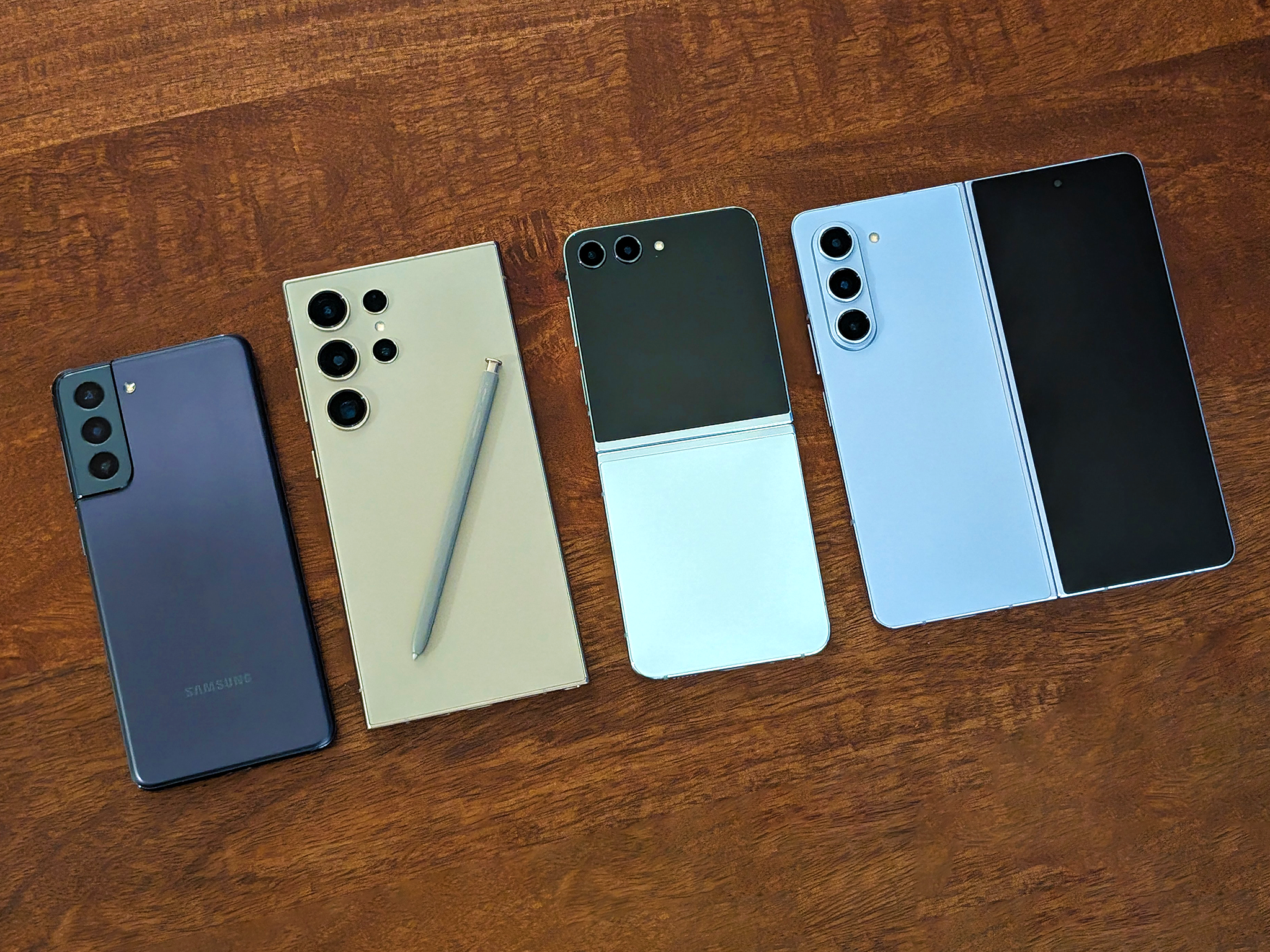 A small selection of the Samsung phones we tested. From left to right: the Galaxy S21, S24 Ultra, Z Flip 5 and Z Fold 5