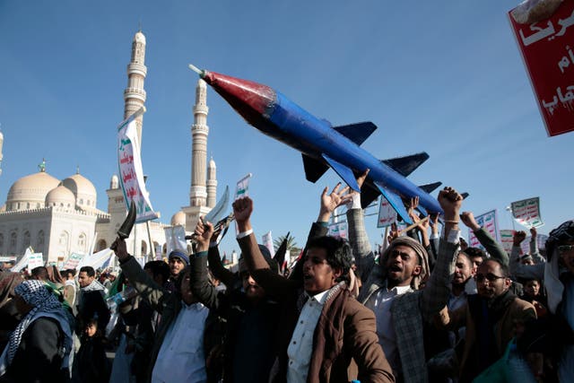 Houthi supporters attend a rally in support of the Palestinians in the Gaza Strip and against the US-led airstrikes on Yemen, in Sanaa, Yemen on Friday (Osamah Abdulrahman/AP)