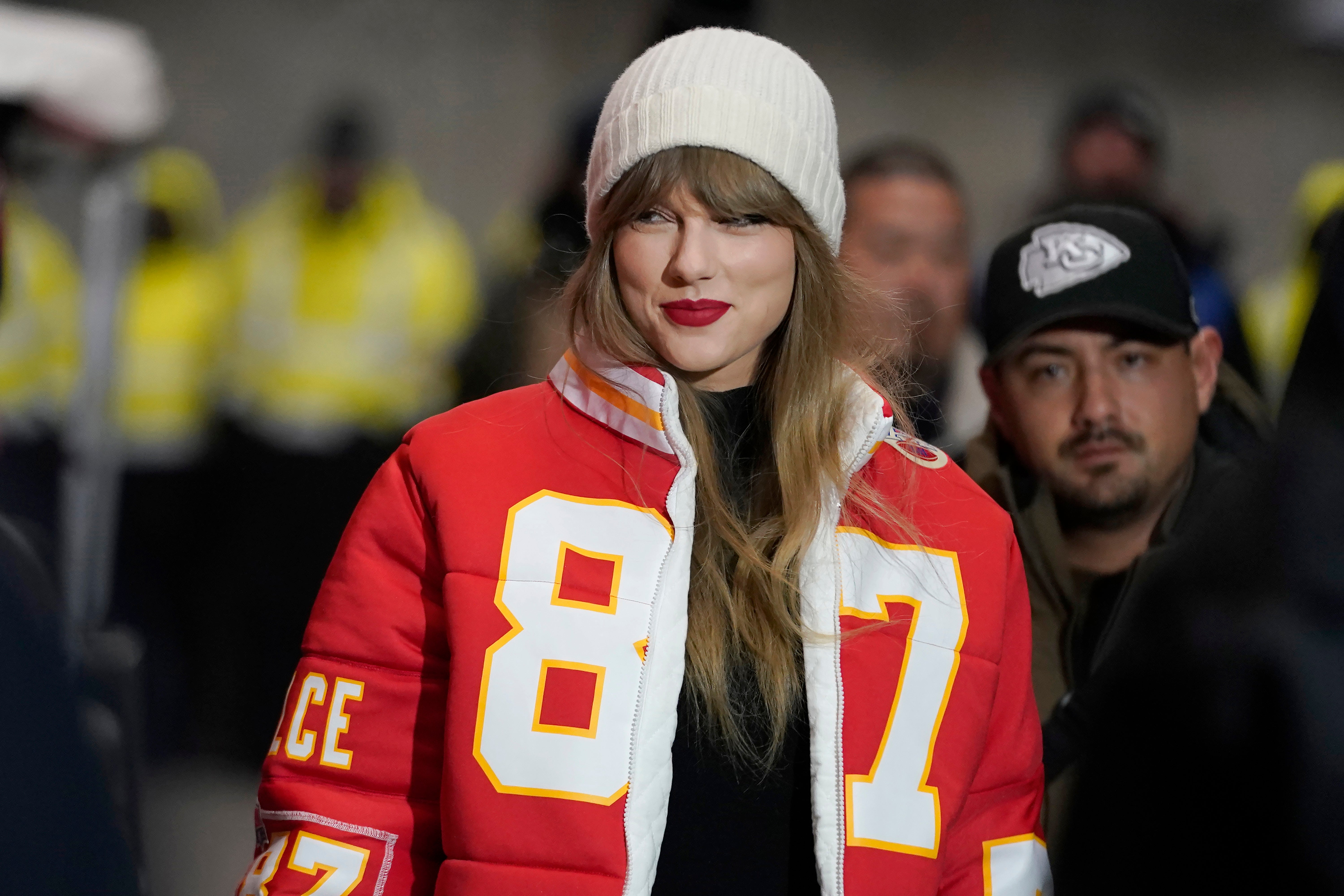 Taylor Swift wearing a Chiefs jacket