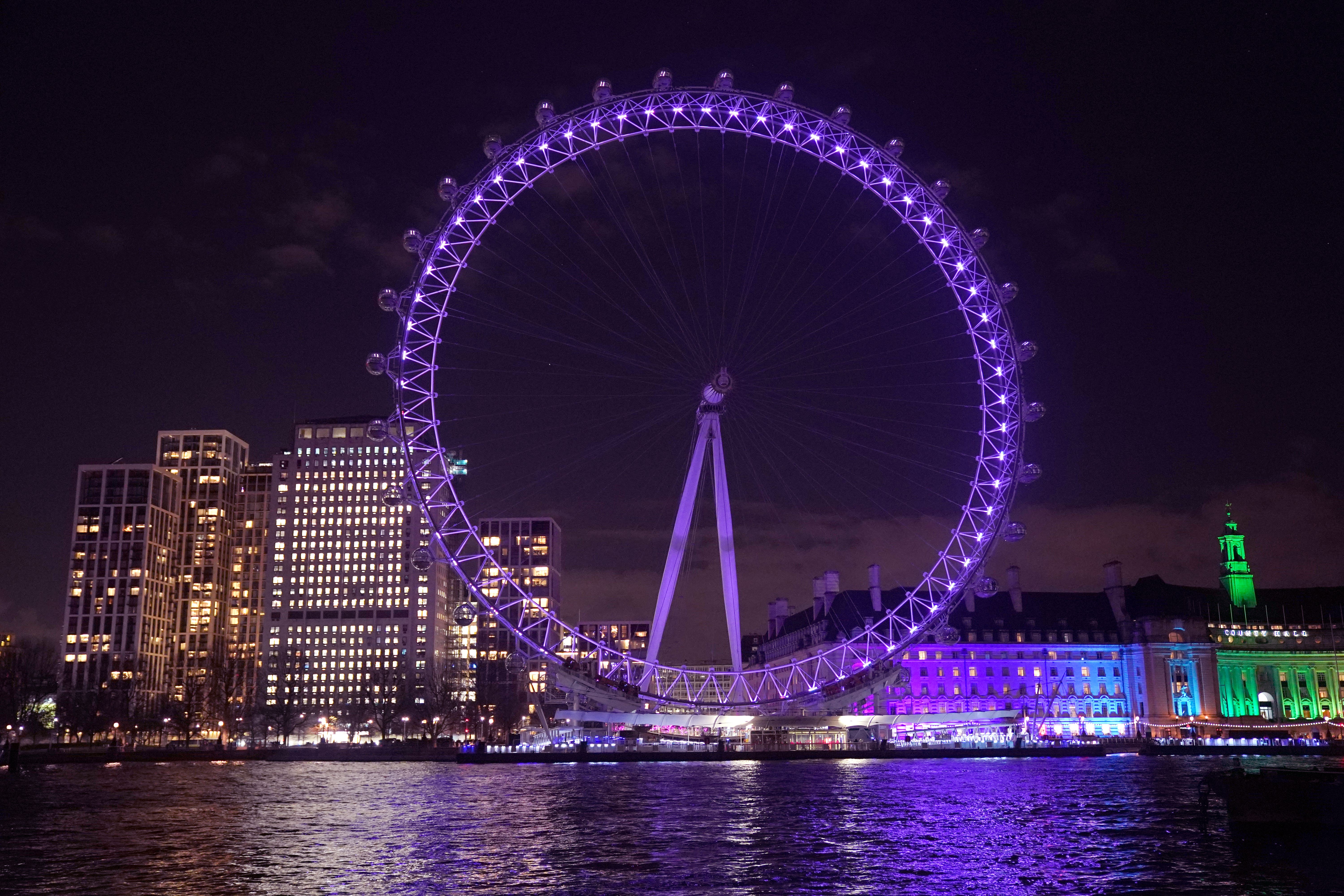 The London Eye in Westminster was among the landmarks lit up to make Holocaust Memorial Day (Jonathan Brady/PA)