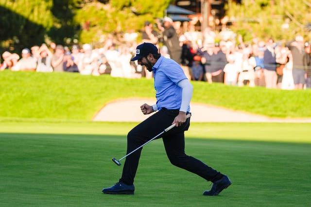 <p>Matthieu Pavon celebrates on the 18th green of the South Course at Torrey Pines after winning the Farmers Insurance Open golf tournament in San Diego (Gregory Bull, AP)</p>