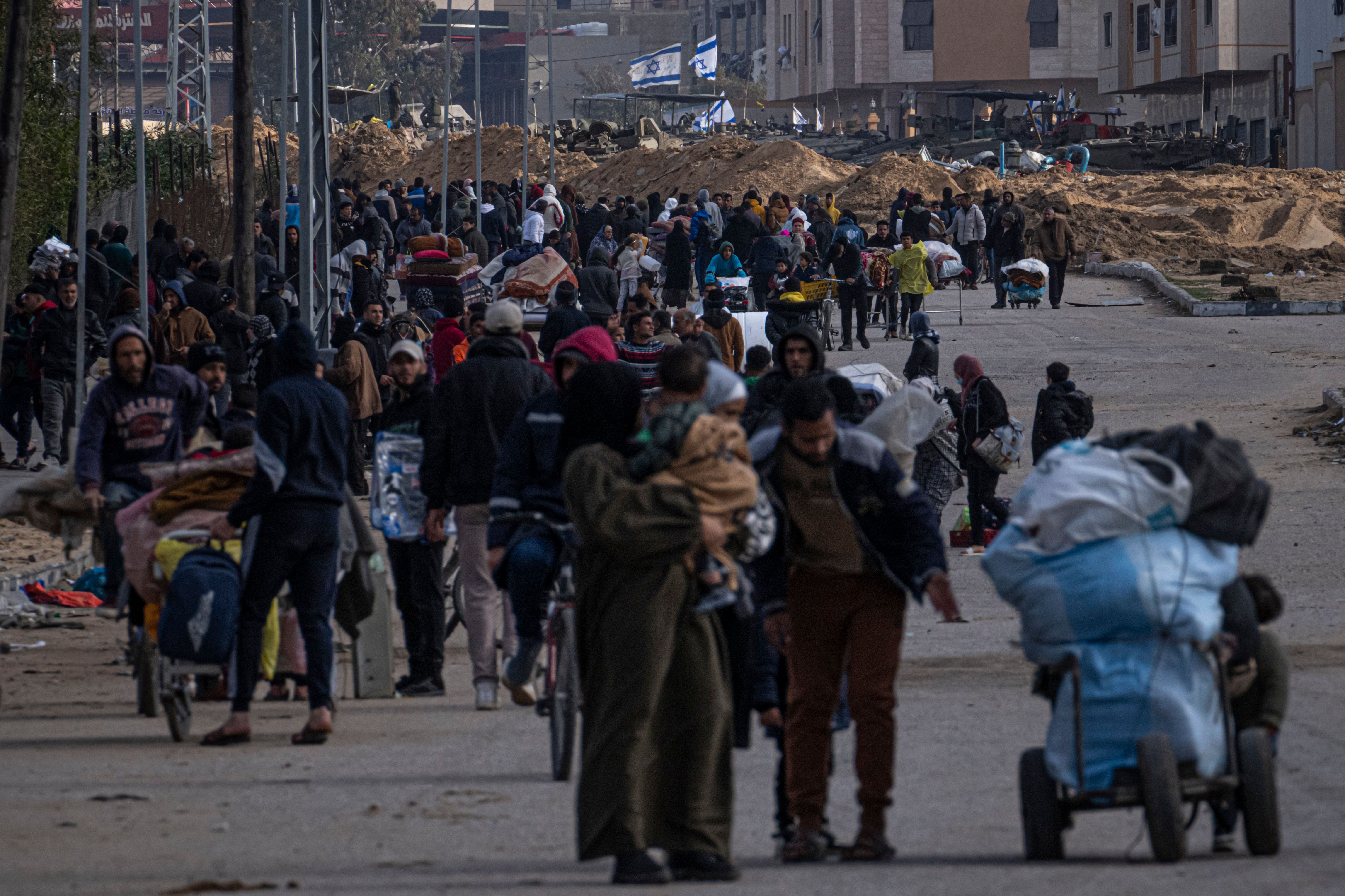 Palestinians flee the Israeli ground offensive in Khan Younis on Sunday