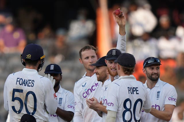 Tom Hartley, centre, celebrates his five-wicket haul against India (Mahesh Kumar A/AP)