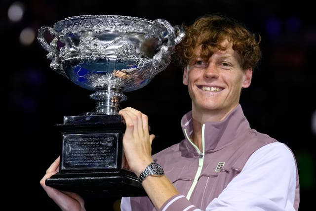 <p>Jannik Sinner holds the Norman Brookes Challenge Cup (Andy Wong/AP)</p>