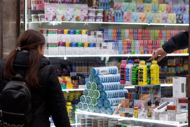 <p>A customer looks at a US-themed candy store</p>