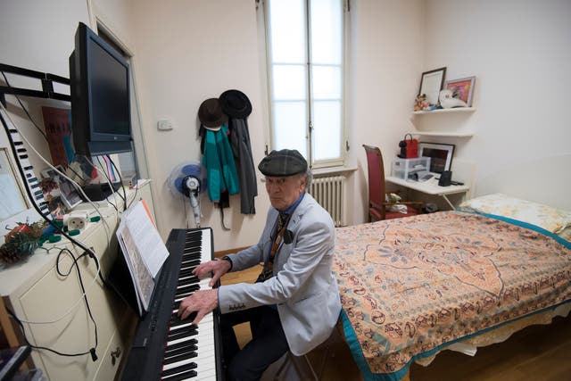 <p>Retired Italian pianist Raimondo Campisi plays in his room on February 13, 2019 at “Casa Verdi”, a retirement home for musicians created in December 1899 by Italian opera composer Giuseppe Verdi for musicians who found themselves poverty-stricken in old age</p>