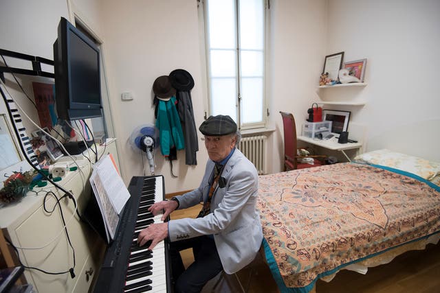 <p>Retired Italian pianist Raimondo Campisi plays in his room on February 13, 2019 at “Casa Verdi”, a retirement home for musicians created in December 1899 by Italian opera composer Giuseppe Verdi for musicians who found themselves poverty-stricken in old age</p>