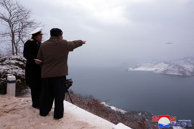 <p>The North Korean leader Kim Jong-un (right) inspects a test-fire of the submarine-launched strategic cruise missile ‘Pulhwasal-3-31’  </p>