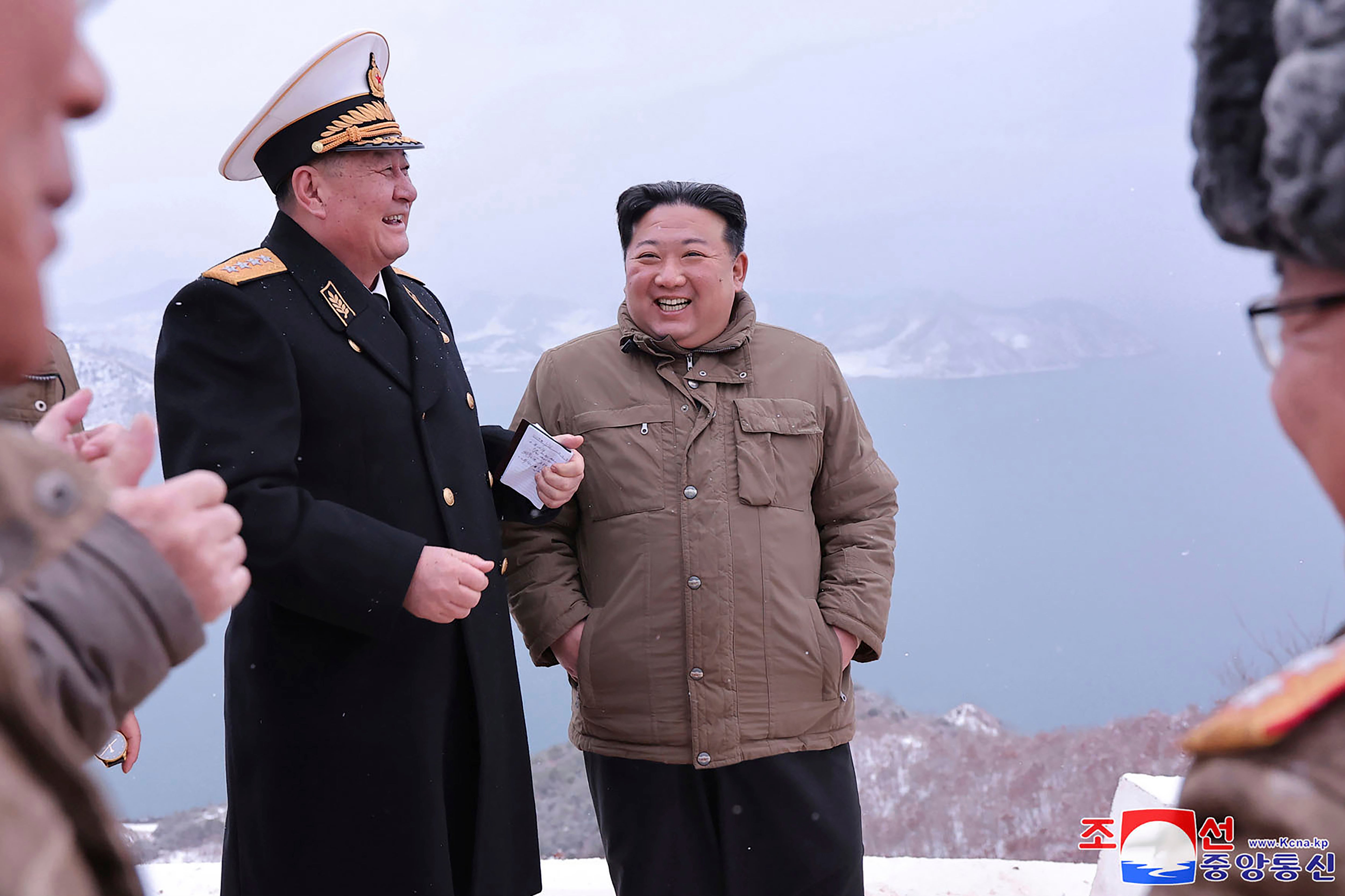 In this photo provided by the North Korean government, North Korean leader Kim Jong Un, right, stands with a North Korean general