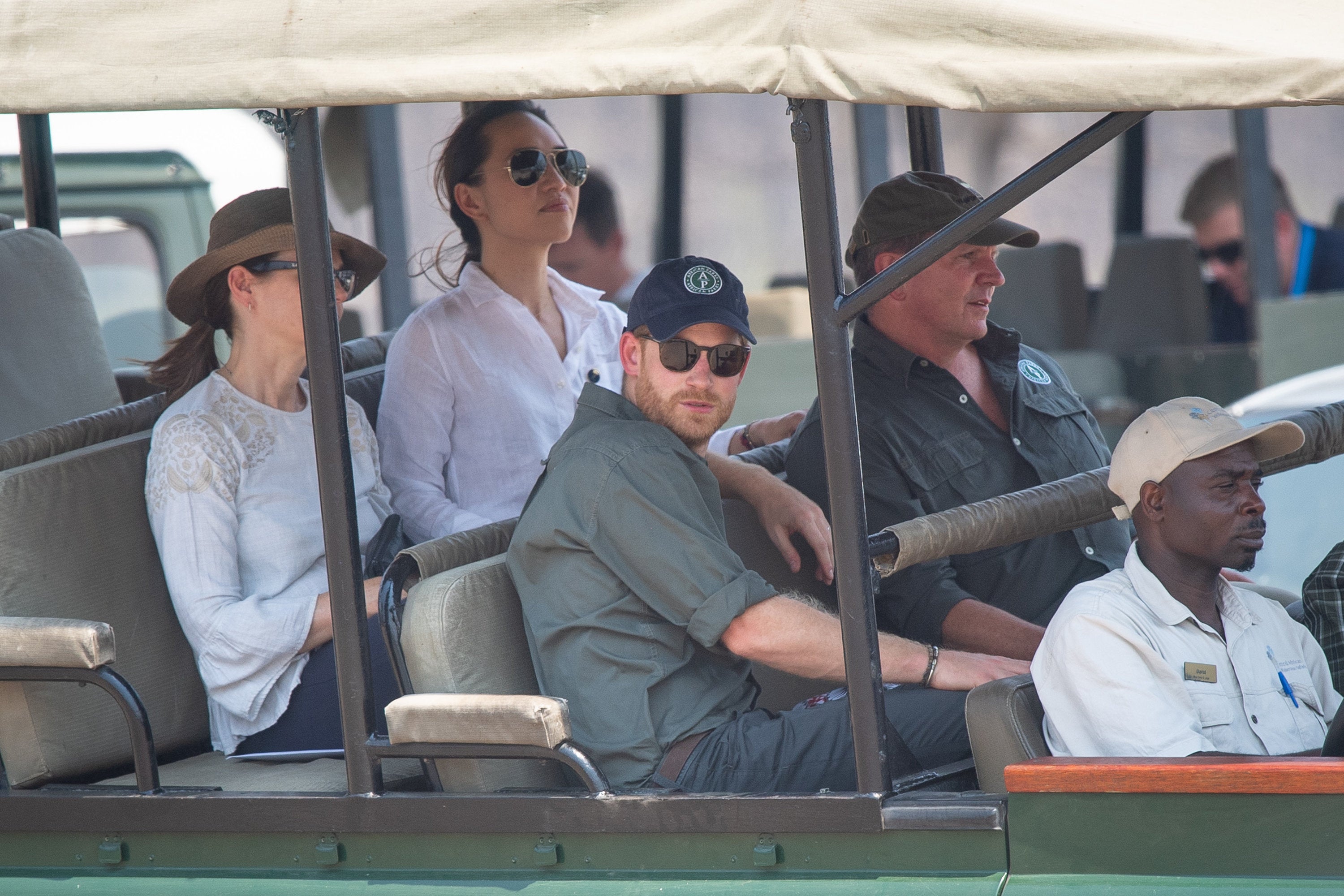 Prince Harry, Duke of Sussex (front centre) arrives by safari jeep to watch an anti-poaching demonstration exercise