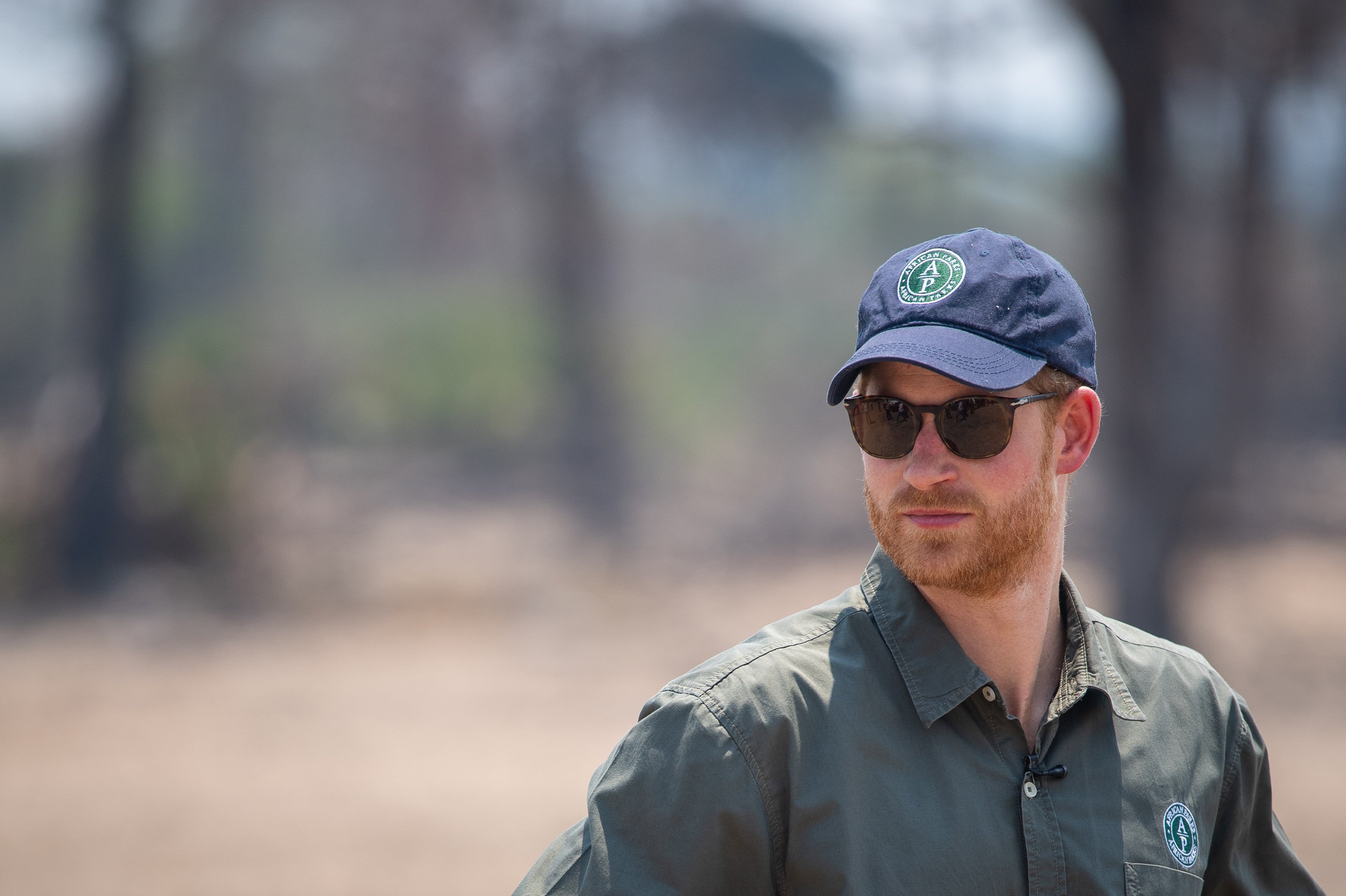 Prince Harry, Duke of Sussex watches an anti-poaching demonstration exercise at the Liwonde National Park during the royal tour of Africa