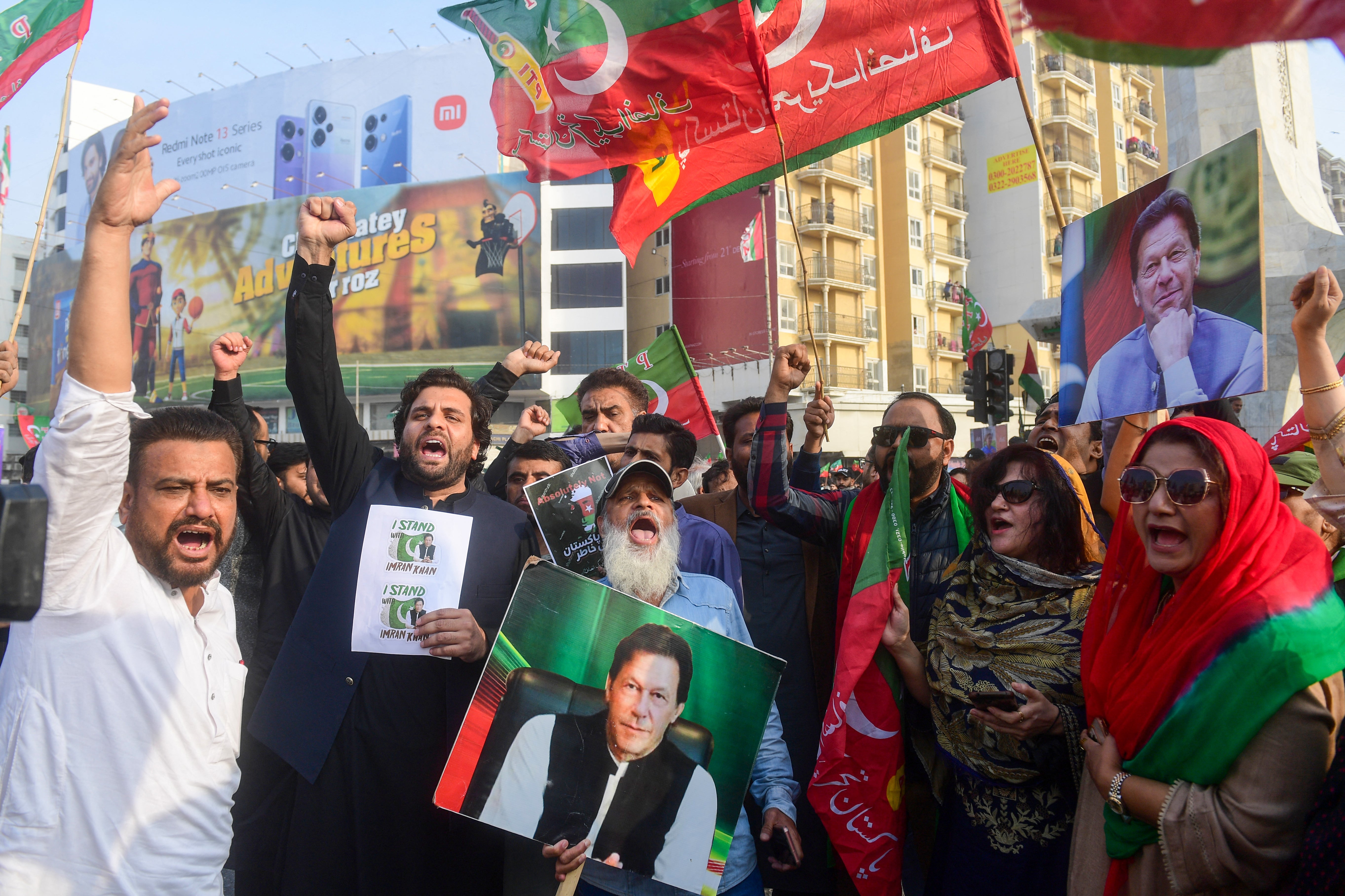 Supporters of Pakistan Tehreek-e-Insaf (PTI) party shout slogans and protest to demand the release of Pakistan's jailed former prime minister Imran Khan