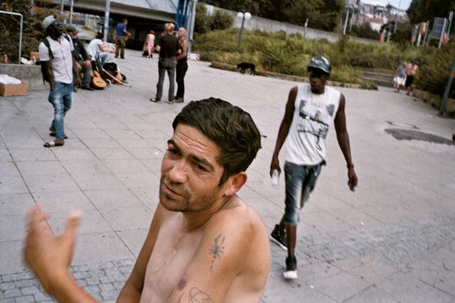 <p>A man breaks away from a group of homeless people around the central station to chat with the photographer in Gorlitz </p>