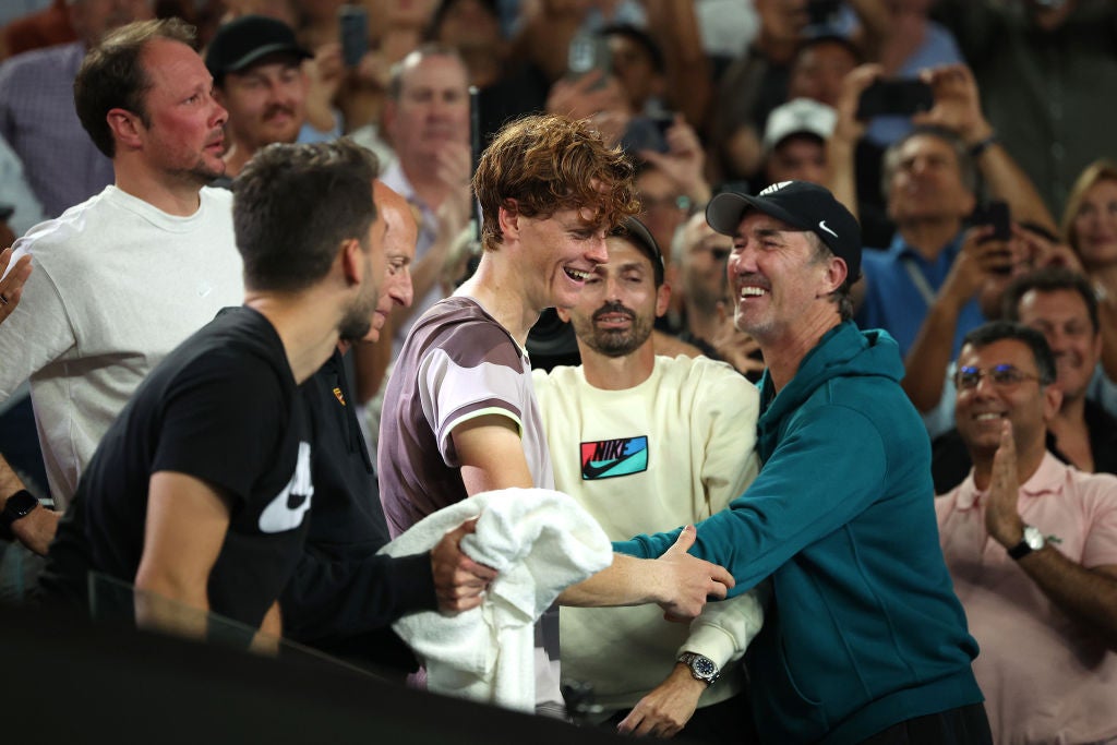 Jannik Sinner celebrates winning the Australian Open with coach Darren Cahill