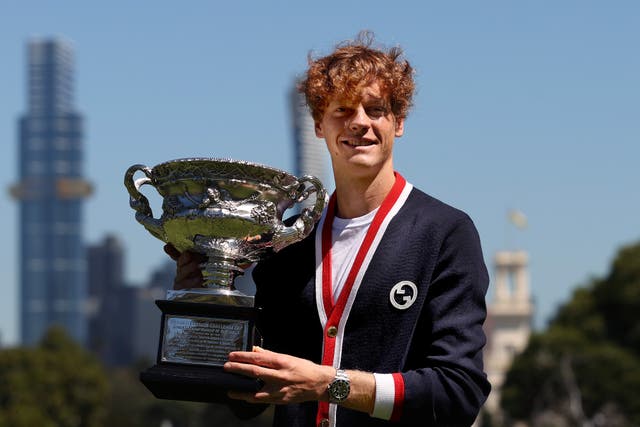 <p>Jannik Sinner poses with the Norman Brookes Challenge Cup after winning the Australian Open Final</p>