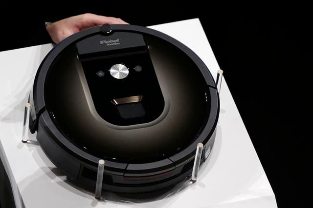A Roomba 980 vacuum cleaning robot Eugene Hoshiko/AP)
