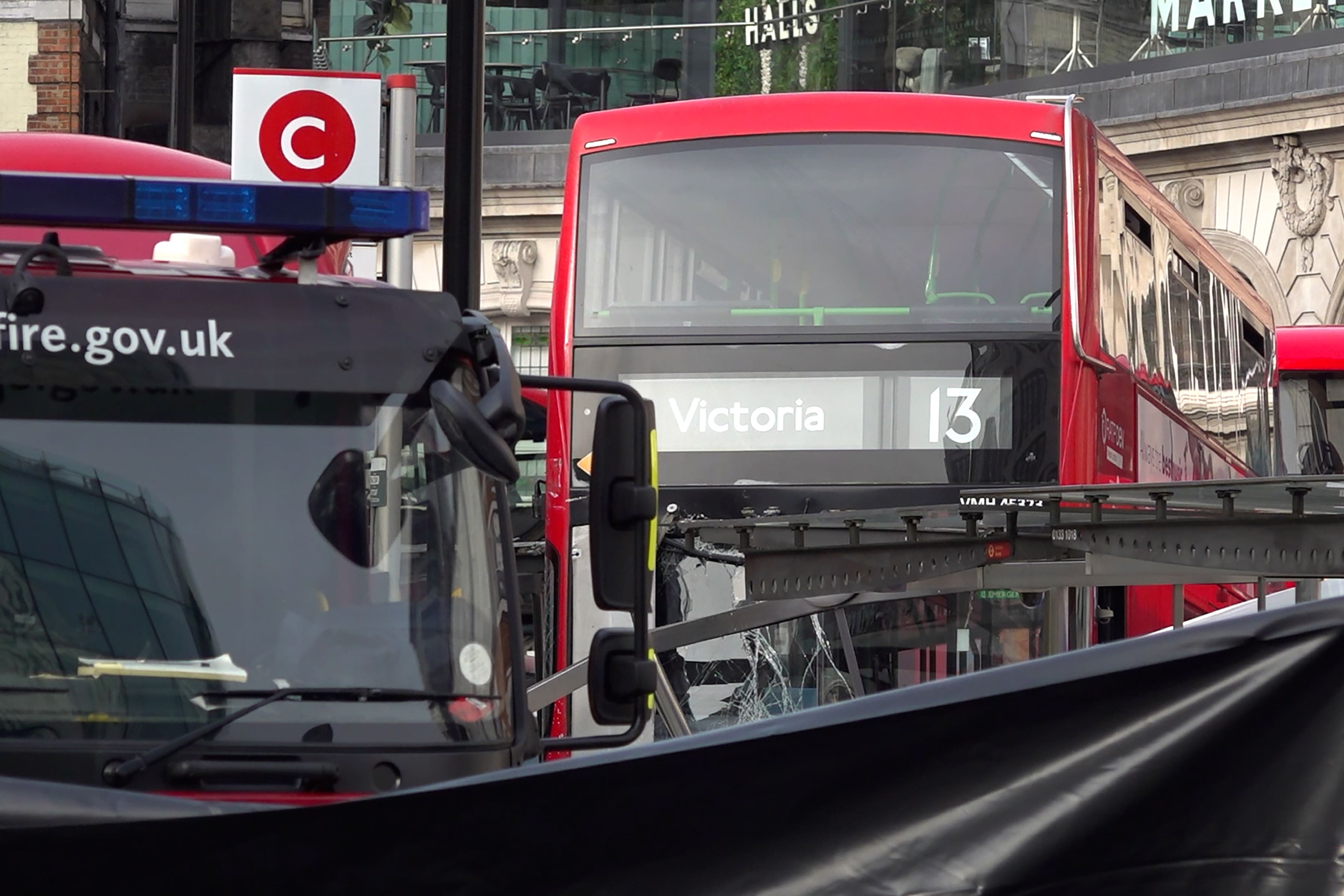 The scene where a pedestrian died after being hit by a bus at London Victoria bus station in central London (PA)