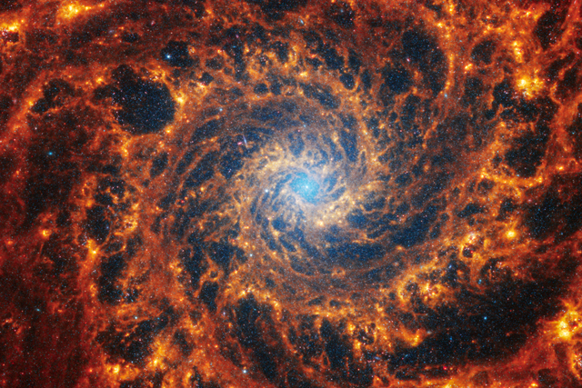 <p>Image of face-on spiral galaxy, NGC 628 as taken by Webb telescope</p>