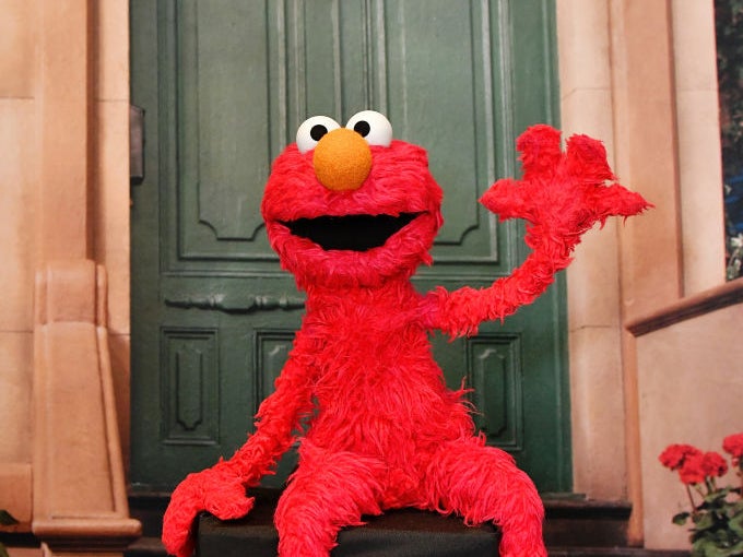Elmo poses at a photo booth in New York City