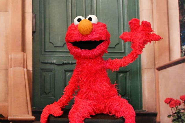 <p>Elmo poses at a photo booth in New  York City</p>