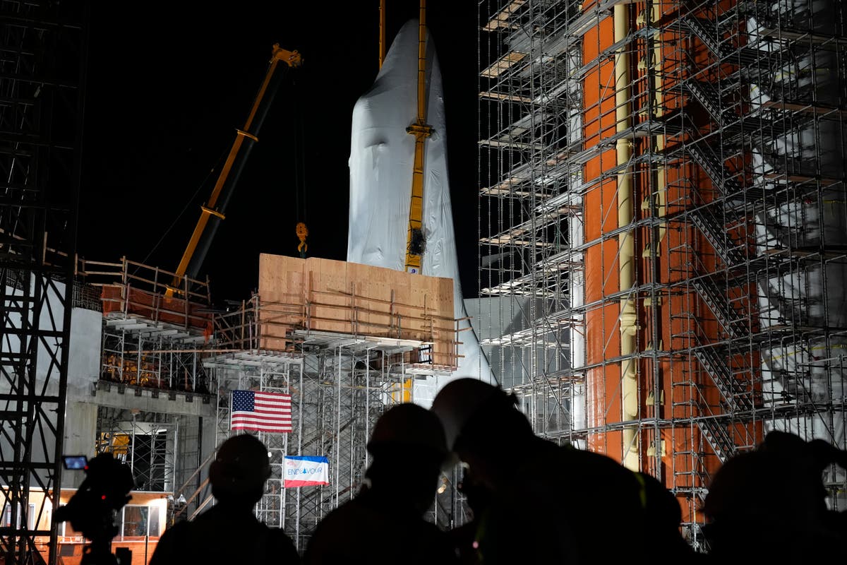 Space Shuttle Endeavour hoisted for installation in vertical display at Los Angeles science museum