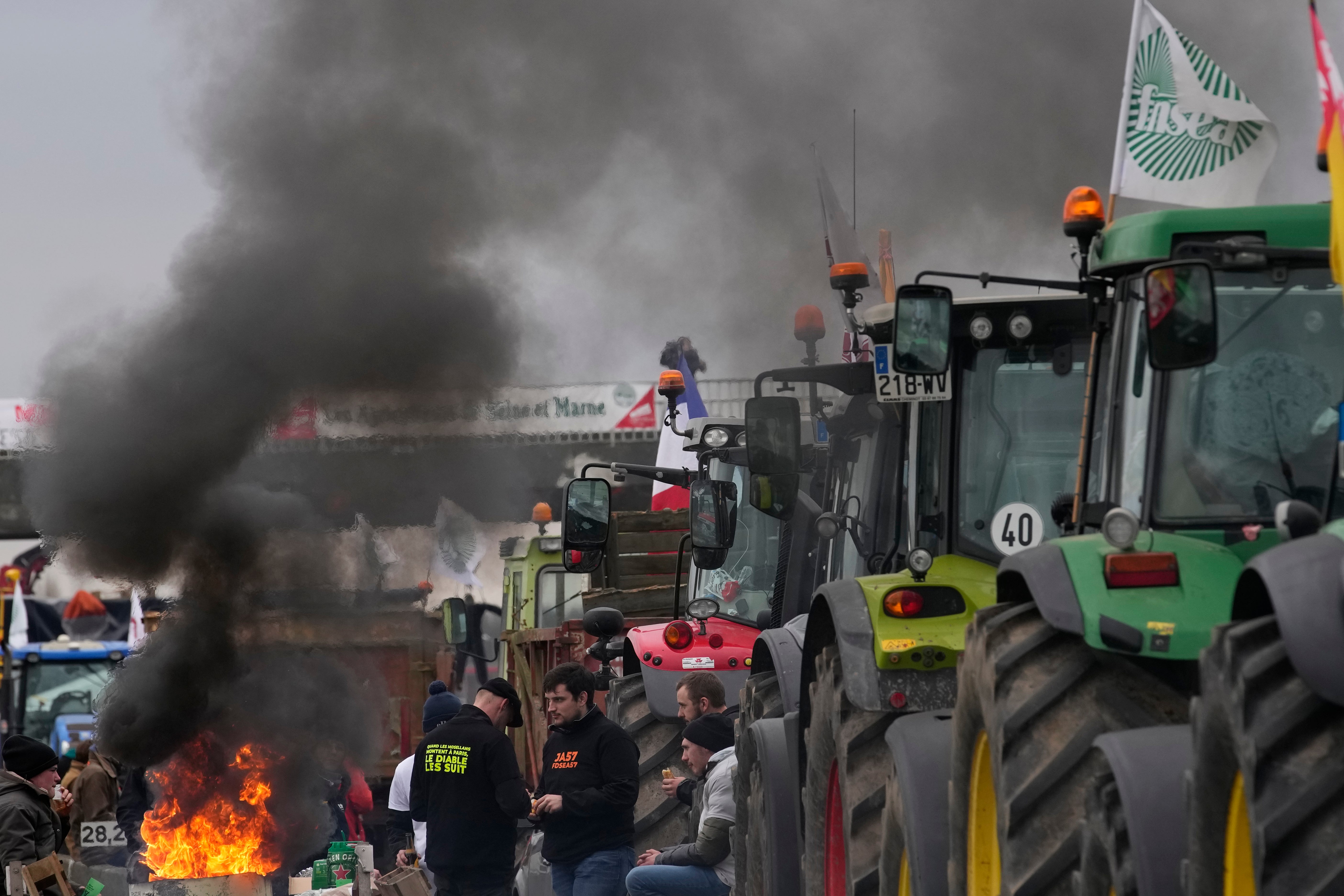 Farmers block a highway in Jossigny, east of Paris