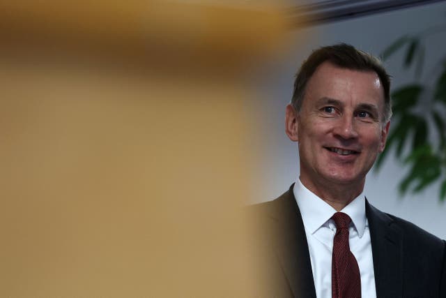 Mr Hunt has previously said he wants to cut taxes in the March budget if he can (Daniel Leal/PA)