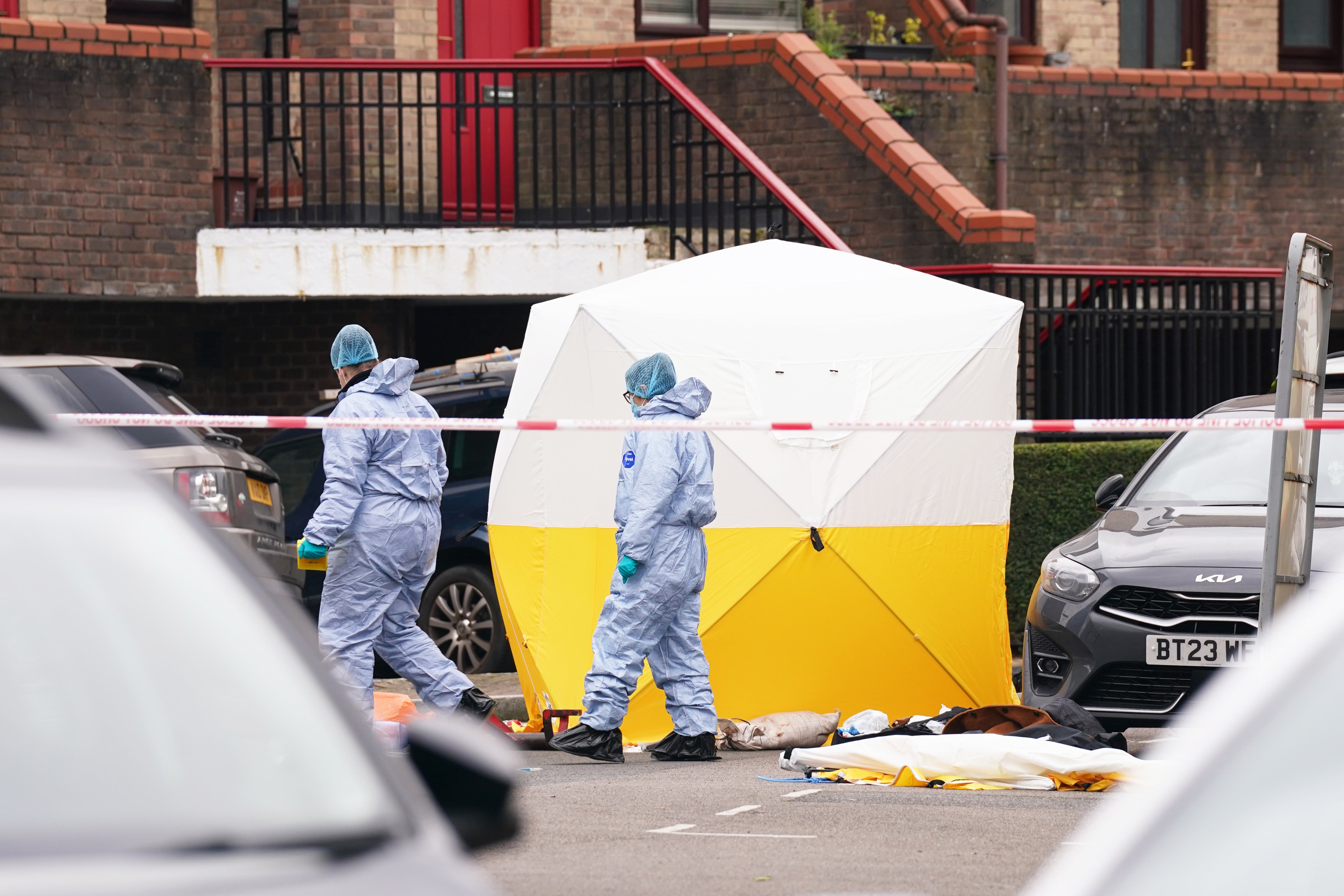 Police forensic officers at the scene near Bywater Place in Surrey Quays (PA)