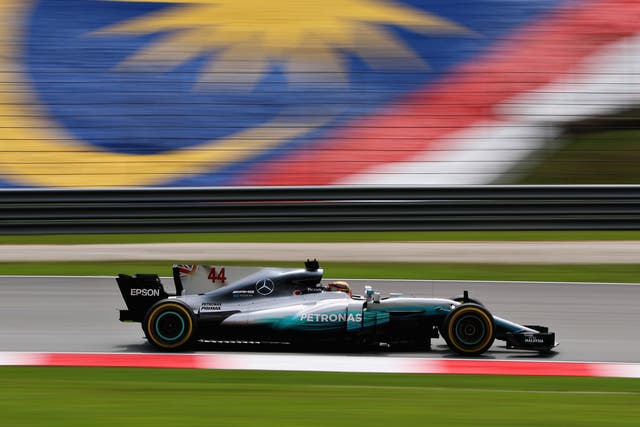 <p>Lewis Hamilton driving during practice for the Malaysia F1 Grand Prix in 2017</p>