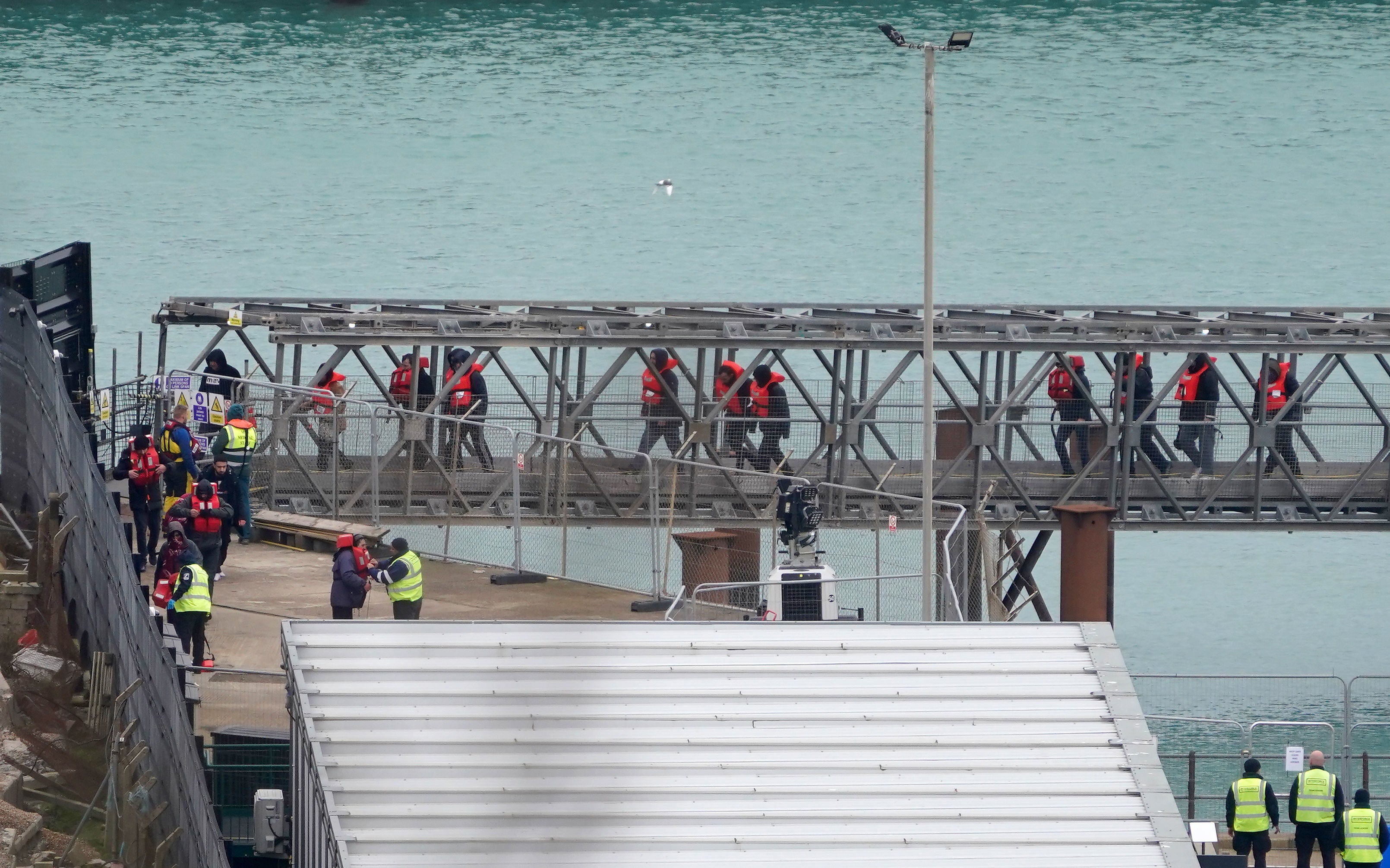 A group of people thought to be migrants are brought in to Dover, Kent