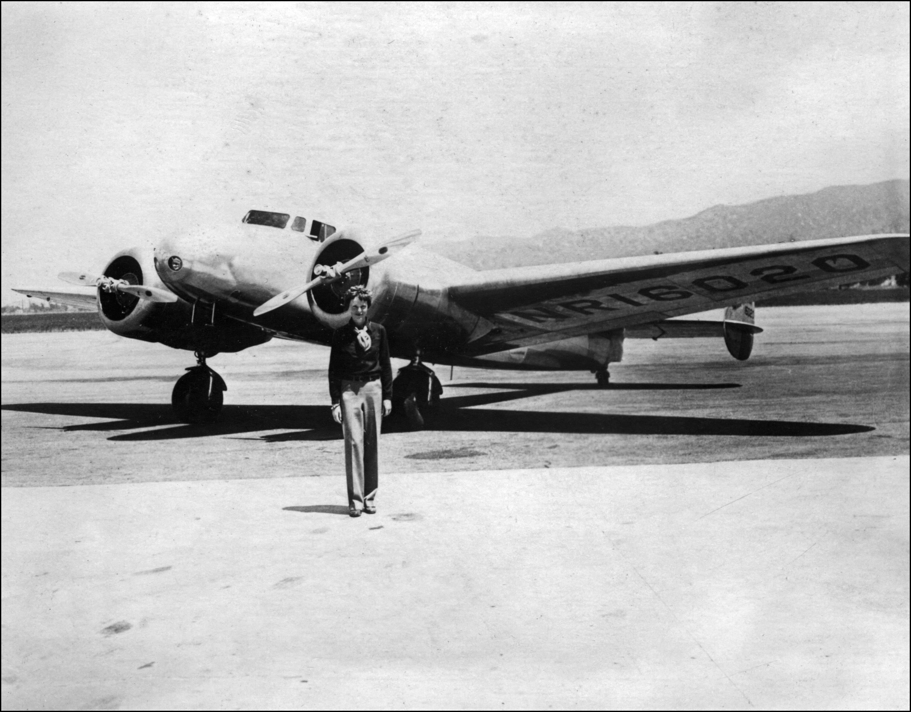 Undated picture taken in the 1930s of US aviator Amelia Earhart in front of her plane