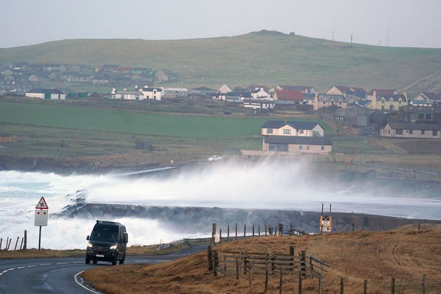 <p>Waves crash over the end of the runway at Sumburgh Airport on Shetland</p>