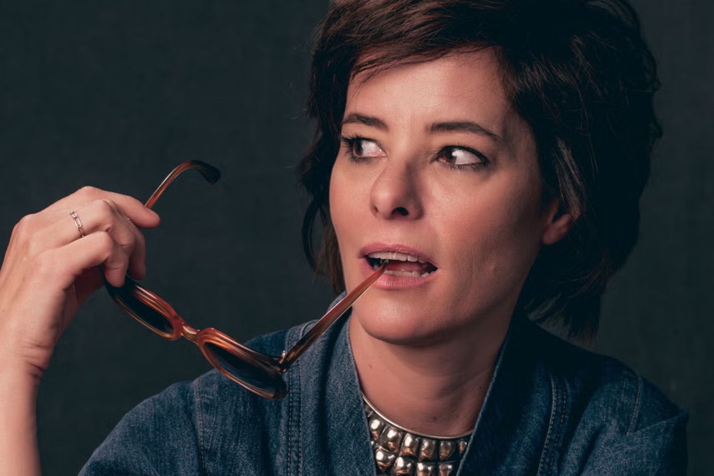 Actor Parker Posey, who narrates and executive produces the new documentary ‘The Booksellers’