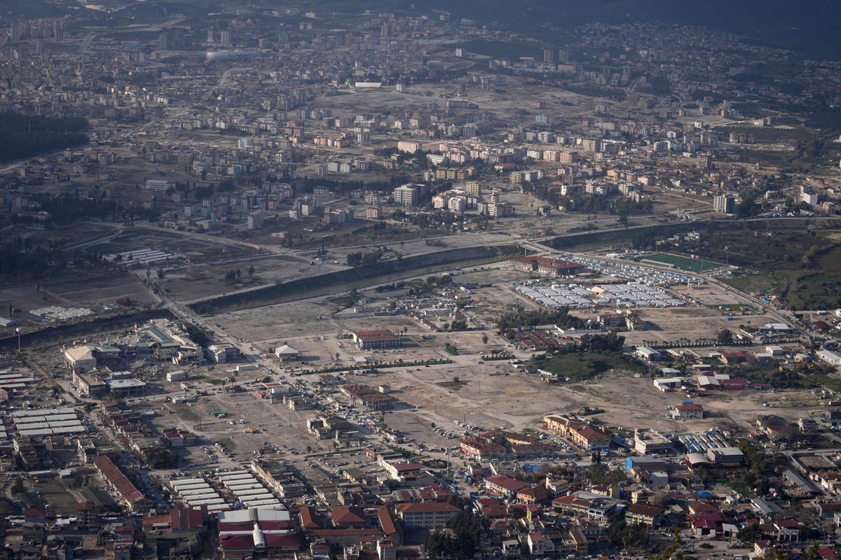 Turkey mourns tens of thousands dead, surrounded by the ruins of last year's earthquake