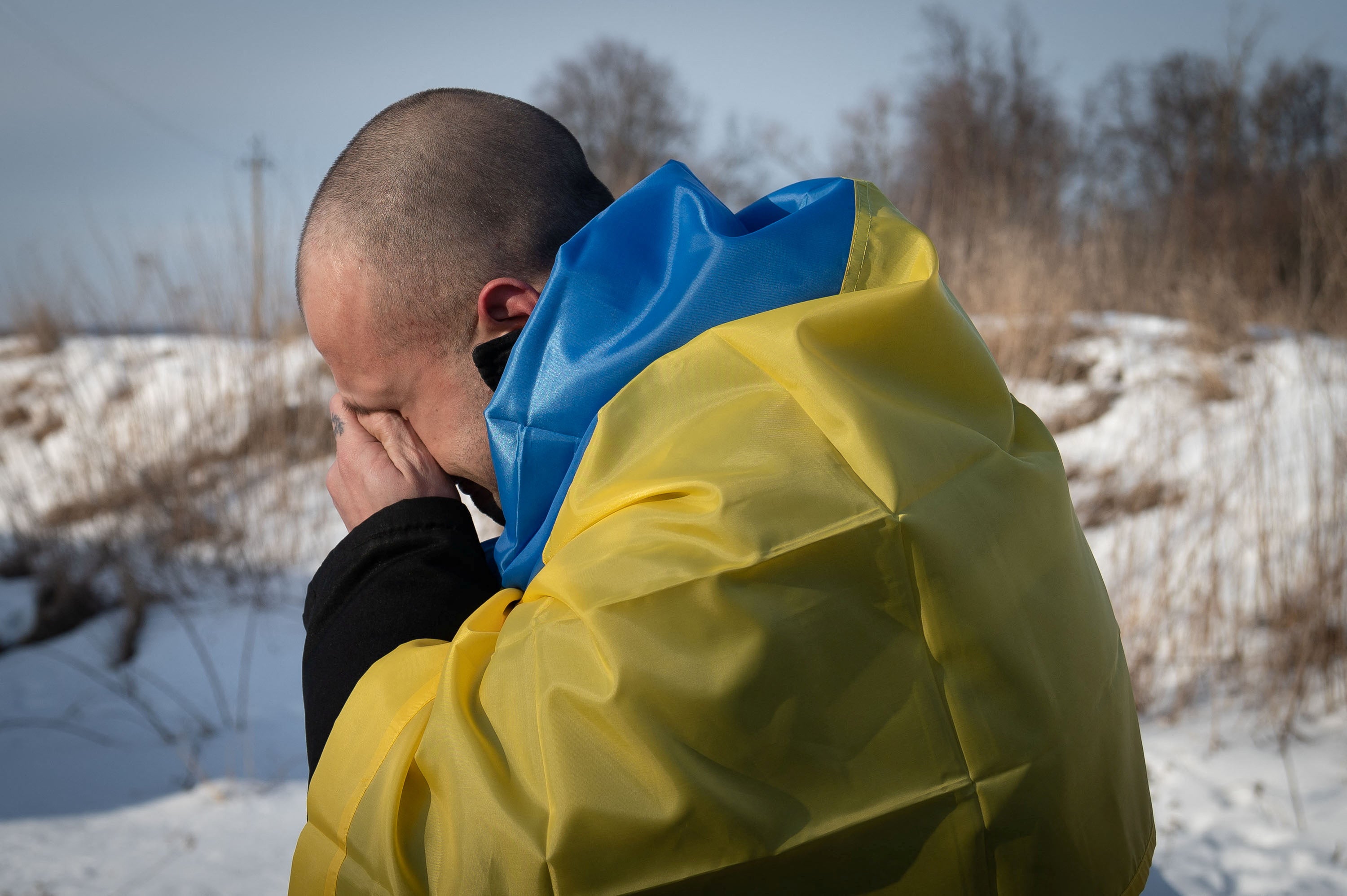 A Ukrainian prisoner of war (POWs) reacts after a swap, amid Russia’s attack on Ukraine, at an unknown location in Ukraine