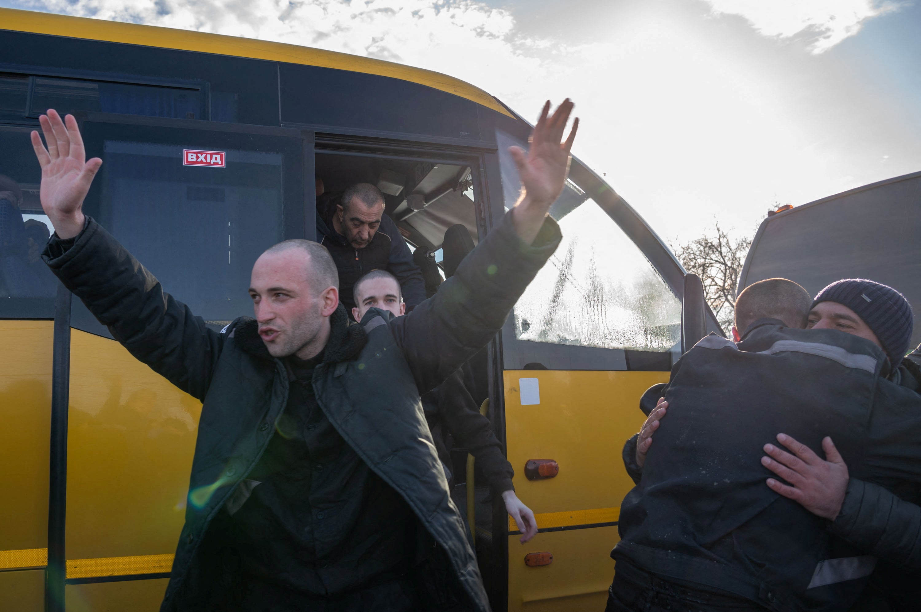 Ukrainian prisoners of war (POWs) react after a swap, amid Russia’s attack on Ukraine, at an unknown location in Ukraine