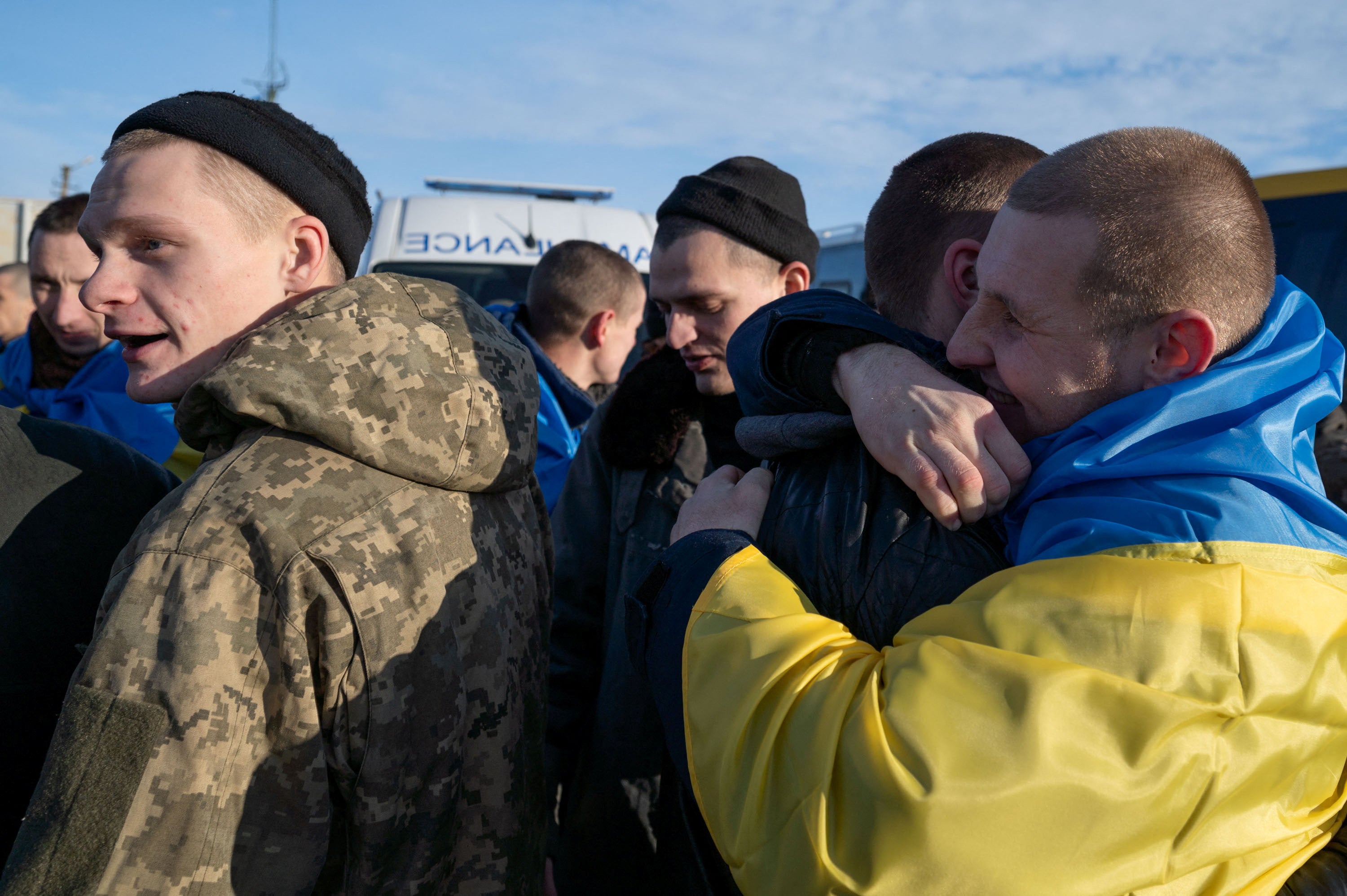Ukrainian prisoners of war (POWs) react after a swap, amid Russia’s attack on Ukraine, at an unknown location in Ukraine